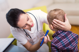 Examination of the ear in a small patient